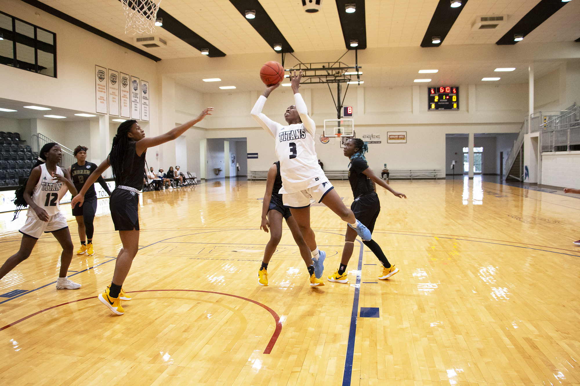 Tamira Anderson shooting in the paint against Andrew College defender